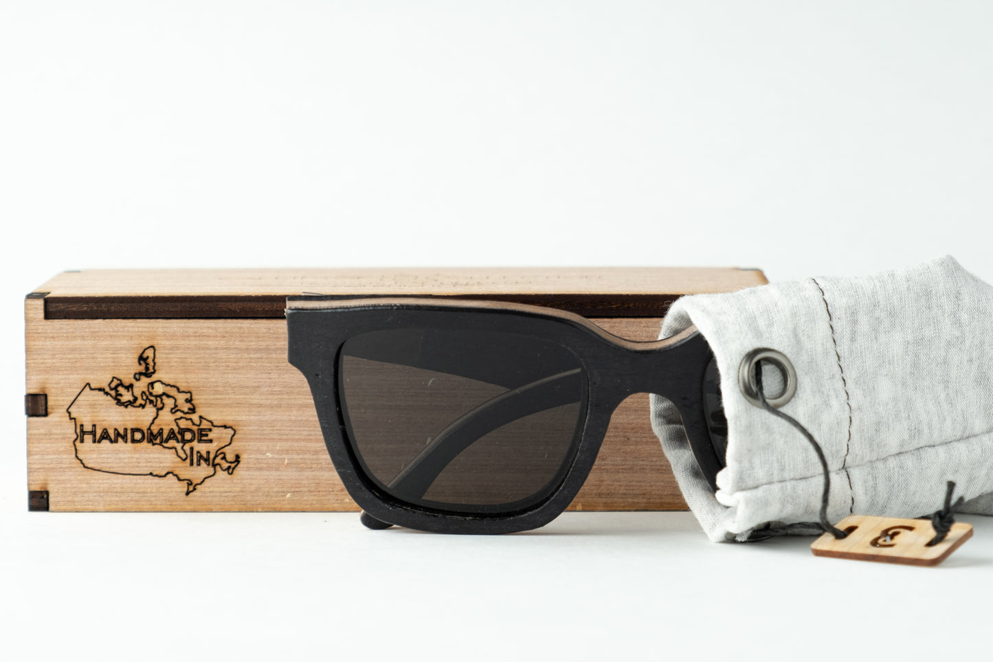 Wood frame sunglasses with a wood hard case and fabric soft case
